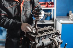 The,Mechanic,Installs,A,New,Piston.,Disassemble,Engine,Block,Vehicle.